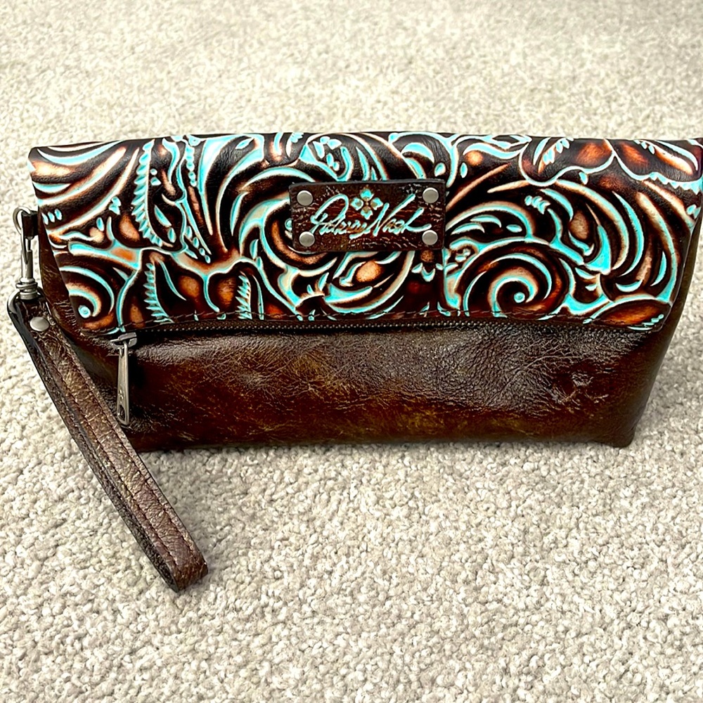 Patricia Nash Leather wristlet. Brown with Teal embossed design. C102